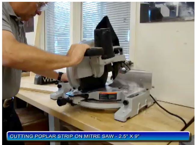 PHOTO OF USING A POWER MITRE BOX SAW