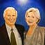 Oil painting of an elderly couple.