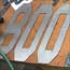 Wood-steel-harder-sign-total-letter-cutout