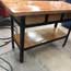 Porch table build showing the back with the side wood being mounted.